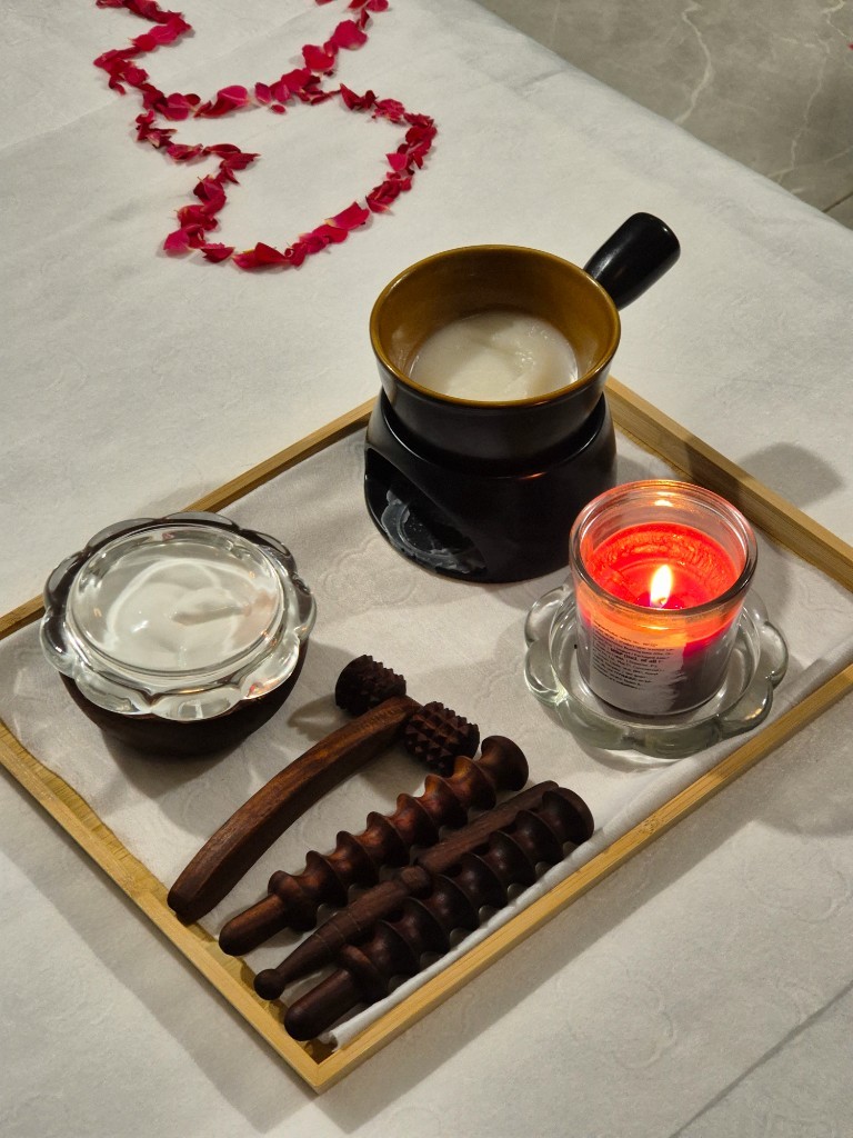 Spa massage tools and aromatherapy setup at Zoyo Luxury Spa